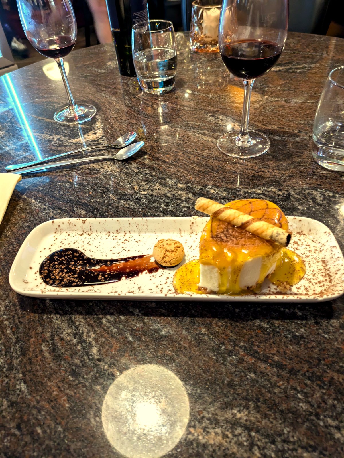Crème brûlée cheesecake with a glass of red wine